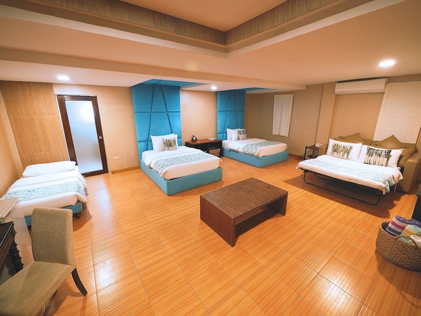 Imagen de la habitación del Hotel Tugawe Cove Resort. Foto 4