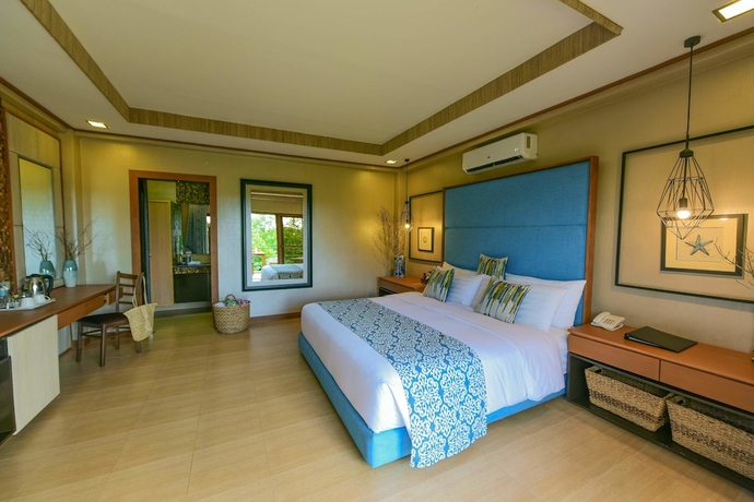 Imagen de la habitación del Hotel Tugawe Cove Resort. Foto 7