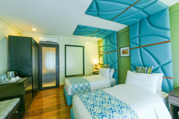 Imagen de la habitación del Hotel Tugawe Cove Resort. Foto 9