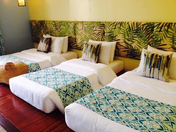 Imagen de la habitación del Hotel Tugawe Cove Resort. Foto 10