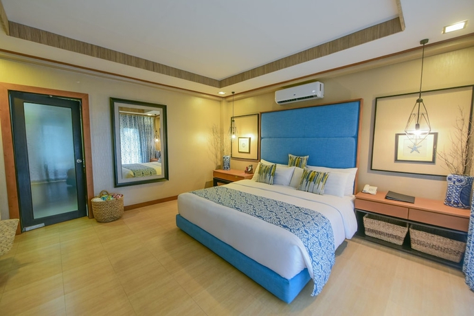 Imagen de la habitación del Hotel Tugawe Cove Resort. Foto 11