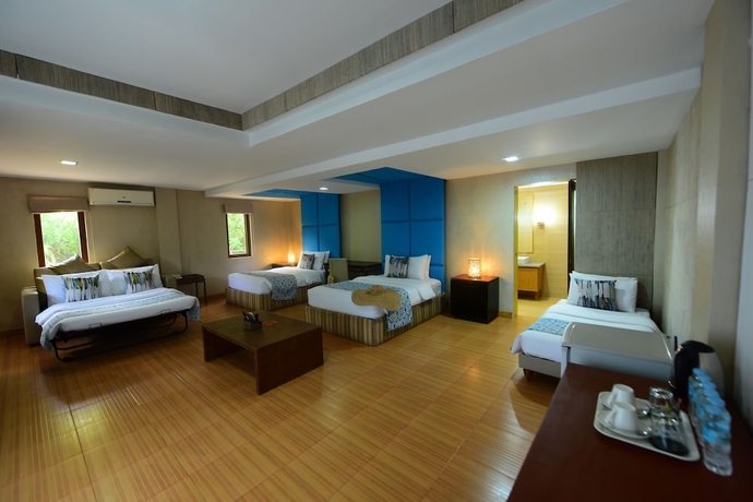 Imagen de la habitación del Hotel Tugawe Cove Resort. Foto 12