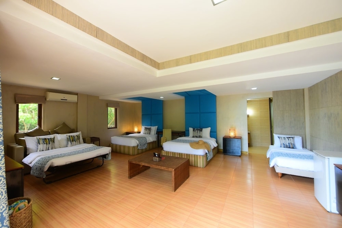 Imagen de la habitación del Hotel Tugawe Cove Resort. Foto 13