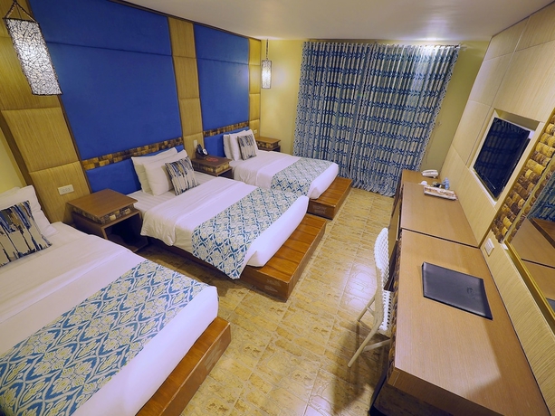 Imagen de la habitación del Hotel Tugawe Cove Resort. Foto 15