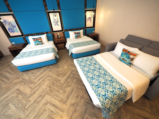 Imagen de la habitación del Hotel Tugawe Cove Resort. Foto 16