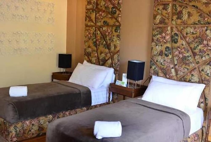 Imagen de la habitación del Hotel Tugawe Cove Resort. Foto 17