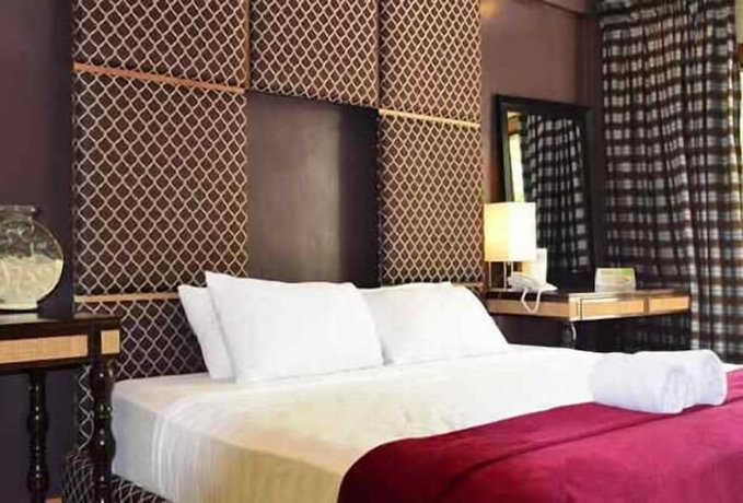 Imagen de la habitación del Hotel Tugawe Cove Resort. Foto 18