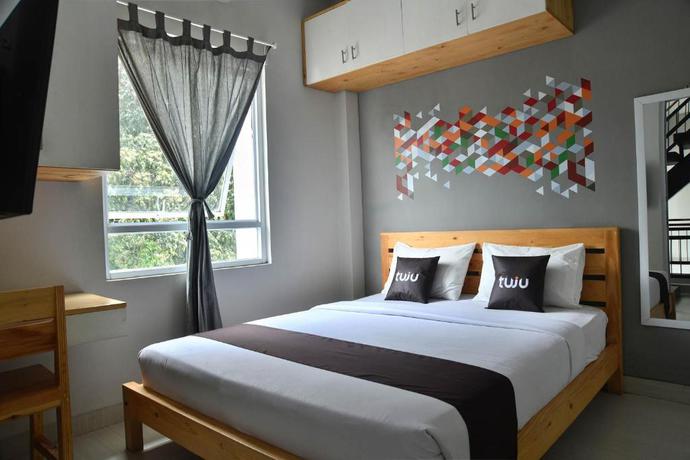 Imagen de la habitación del Hotel Tuju WK Homes Syariah. Foto 2