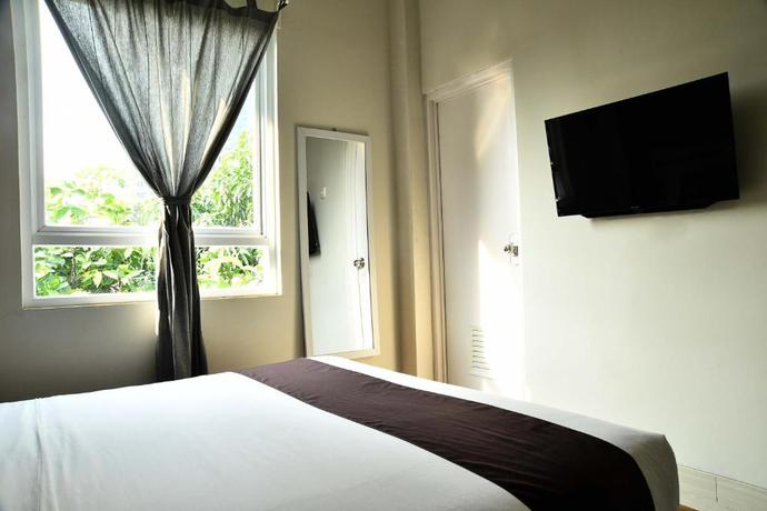 Imagen de la habitación del Hotel Tuju WK Homes Syariah. Foto 3