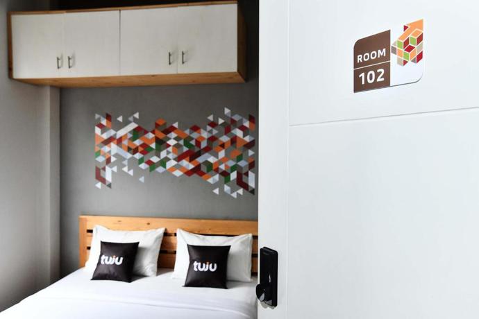 Imagen de la habitación del Hotel Tuju WK Homes Syariah. Foto 4