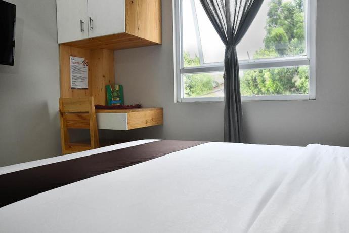 Imagen de la habitación del Hotel Tuju WK Homes Syariah. Foto 5