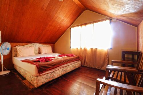 Imagen de la habitación del Hotel Tuk Tuk Timbul Bungalows. Foto 4