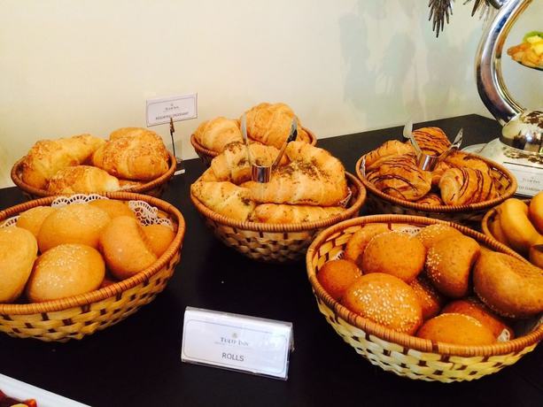 Imagen del bar/restaurante del Hotel Tulip And Suites. Foto 4