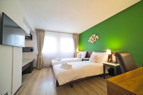 Imagen de la habitación del Hotel Tulip Inn Lausanne Beaulieu. Foto 10