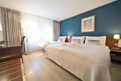 Imagen de la habitación del Hotel Tulip Inn Lausanne Beaulieu. Foto 17