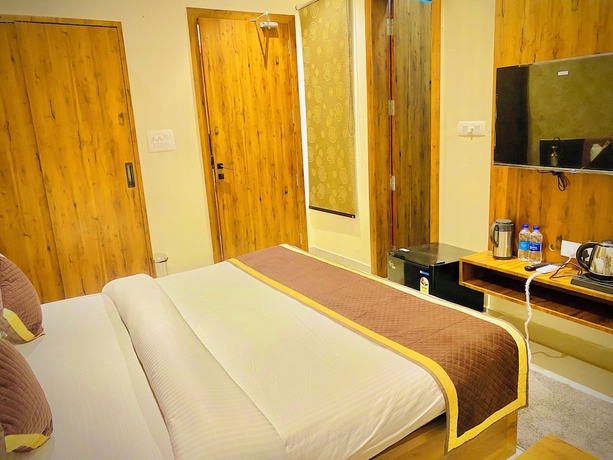 Imagen de la habitación del Hotel Tulsi Grand Inn. Foto 10