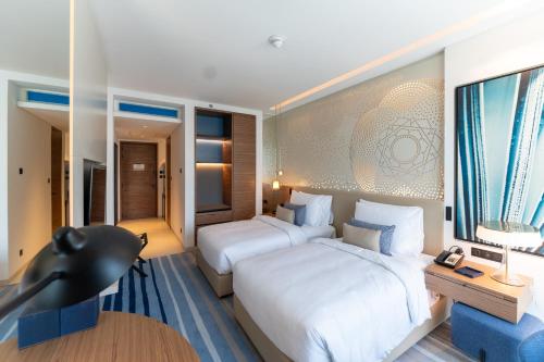 Imagen de la habitación del Hotel Tumbi Hotel Dubai The Palm, Tapestry Collection by Hilton. Foto 4