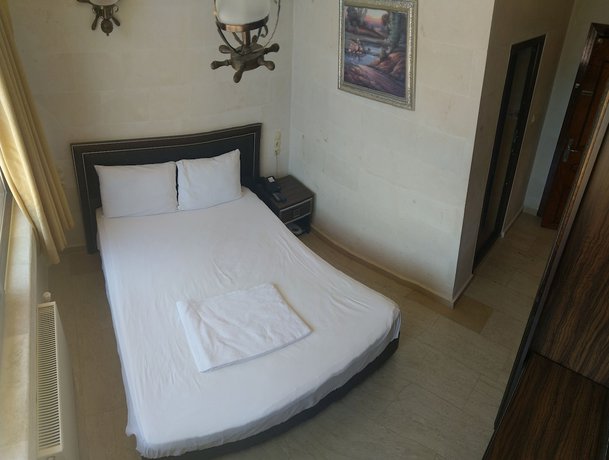 Imagen de la habitación del Hotel Turabdin. Foto 19