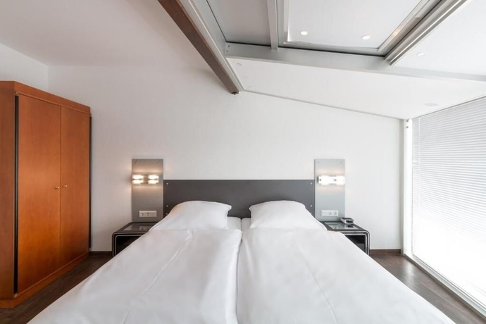 Imagen de la habitación del Hotel Turmhotel Rhein Main. Foto 10