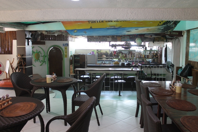 Imagen del bar/restaurante del Hotel Turtle Inn Resort. Foto 4