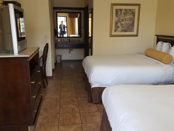 Imagen de la habitación del Hotel Tuscan Garden Inn. Foto 6