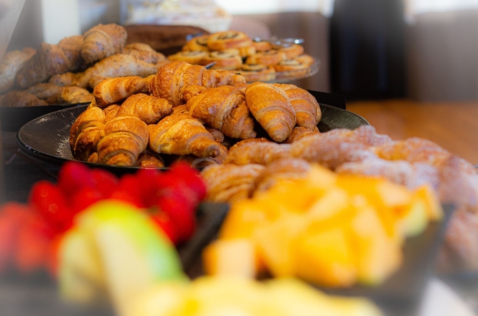 Imagen del bar/restaurante del Hotel Tuscany Inn. Foto 10