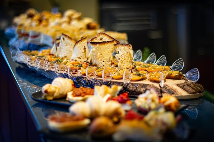 Imagen del bar/restaurante del Hotel Tuscany Inn. Foto 11