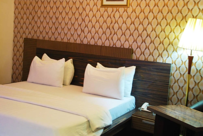 Imagen de la habitación del Hotel Tuscany Suites. Foto 14