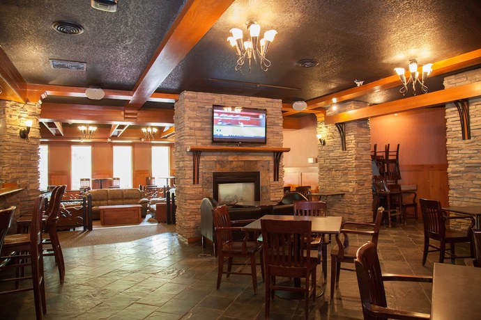 Imagen del bar/restaurante del Hotel Twin Pine Inn and Suites. Foto 3