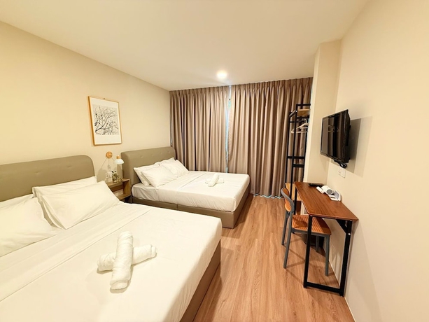 Imagen de la habitación del Hotel TwinTrees Kelawai. Foto 15