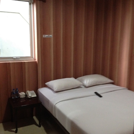 Imagen de la habitación del Hotel Twins Manggadua. Foto 2