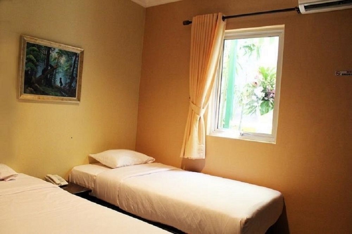 Imagen de la habitación del Hotel Twins Manggadua. Foto 4