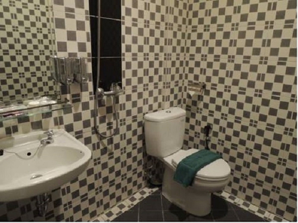Imagen de la habitación del Hotel Twins Manggadua. Foto 5