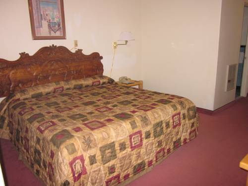 Imagen de la habitación del Hotel Two Sunsets Hotel. Foto 10