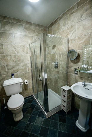 Imagen de la habitación del Hotel Ty Dre Town House. Foto 11