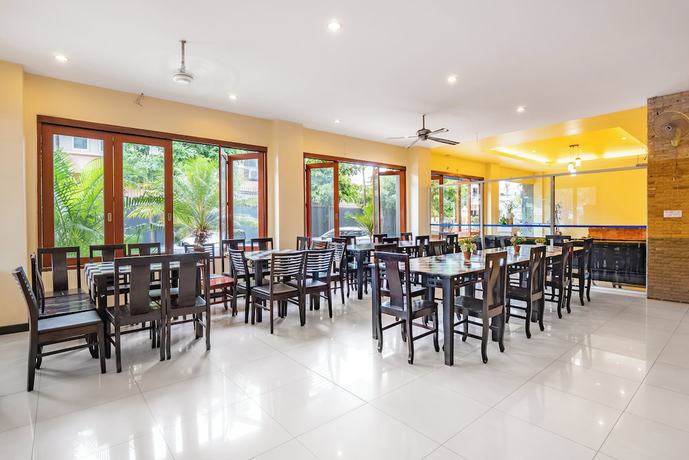 Imagen del bar/restaurante del Hotel Tycoon Place Garden. Foto 4