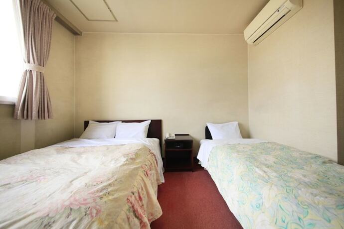 Imagen de la habitación del Hotel U Topia. Foto 25