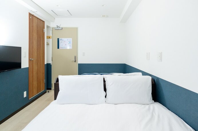 Imagen de la habitación del Hotel UENO WOO HOTEL. Foto 11