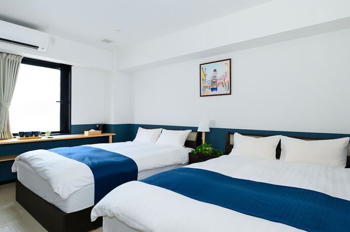 Imagen de la habitación del Hotel UENO WOO HOTEL. Foto 13