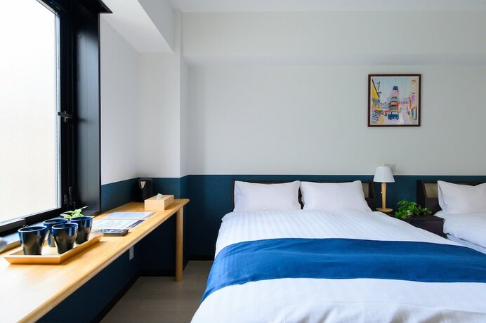 Imagen de la habitación del Hotel UENO WOO HOTEL. Foto 14