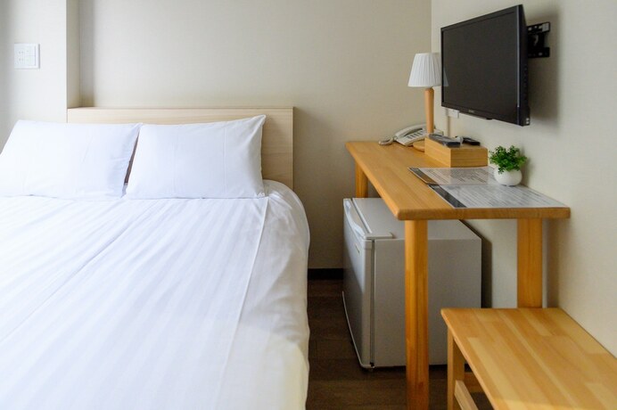 Imagen de la habitación del Hotel UENO WOO HOTEL. Foto 15