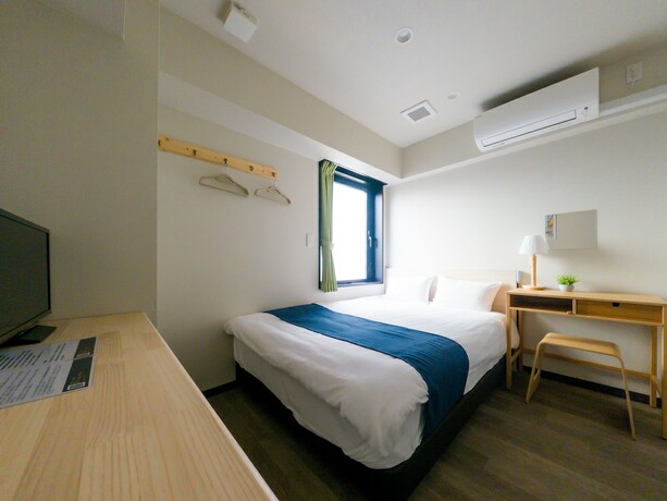 Imagen de la habitación del Hotel UENO WOO HOTEL. Foto 16