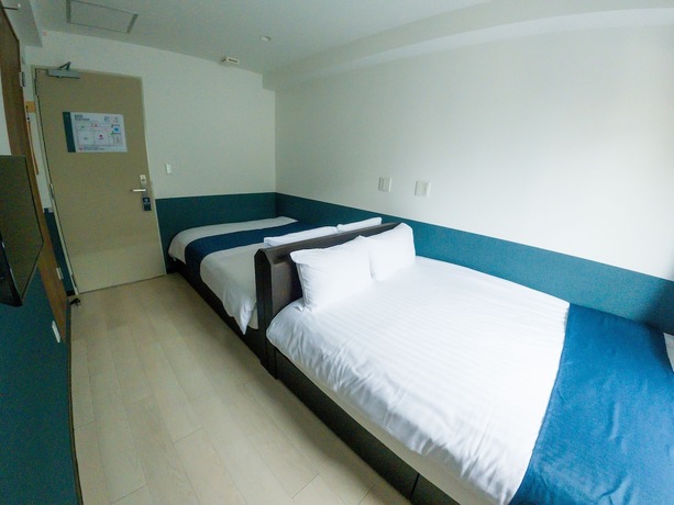 Imagen de la habitación del Hotel UENO WOO HOTEL. Foto 20