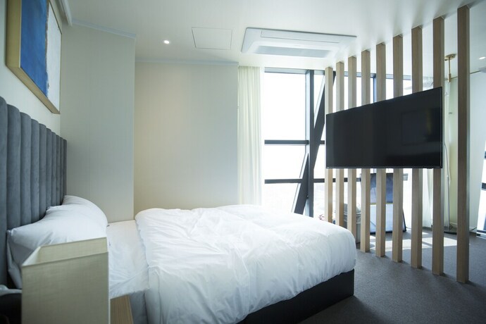 Imagen de la habitación del Hotel UH SUITE Haeundae Landscape 3rd Floor. Foto 7
