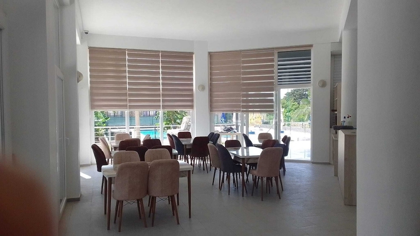Imagen del bar/restaurante del Hotel UMBAY RESORT HOTEL. Foto 7