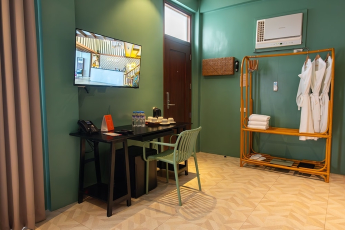 Imagen de la habitación del Hotel UNWND Boutique Dumaguete. Foto 11