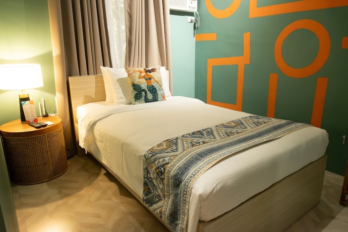 Imagen de la habitación del Hotel UNWND Boutique Dumaguete. Foto 13