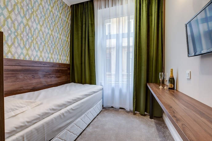 Imagen de la habitación del Hotel UPSTAIRS BOUTIQUE. Foto 2