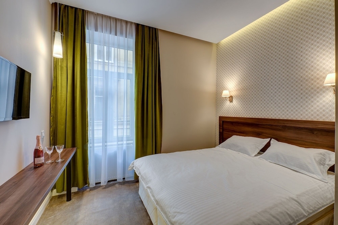 Imagen de la habitación del Hotel UPSTAIRS BOUTIQUE. Foto 4