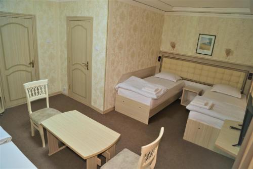 Imagen de la habitación del Hotel URGANCH. Foto 19